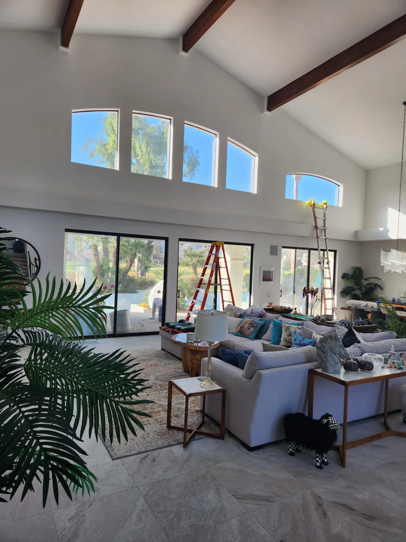 Window film project in a sunlit home with tall windows